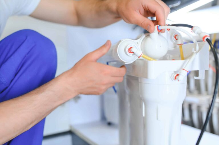 plumber change the water filter